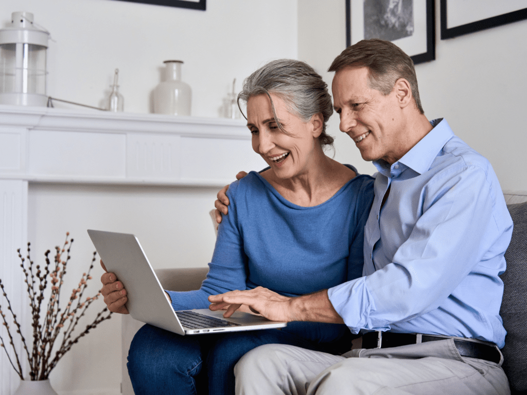 Older couple sit at computer together | Cataract Surgery | Vision Care Clinic | Bristol